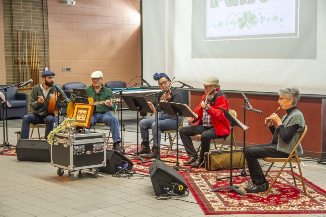 Local Celtic band Failte plays in Bay Cafe on the community college's Escanaba campus on Tuesday for a special, belated St. Patrick's Day edition of "Lunchtime Live," a music series that will be hosted by Bay College over the summer. Seen performing from left to right are Carol Irving – Penny Whistle • Bruce Irving – Guitar • Bob Yin – Fiddle • Rachelle St. John – Fiddle • Trevor St. John • Katie Bender-Fiddle(R. R. Branstrom)